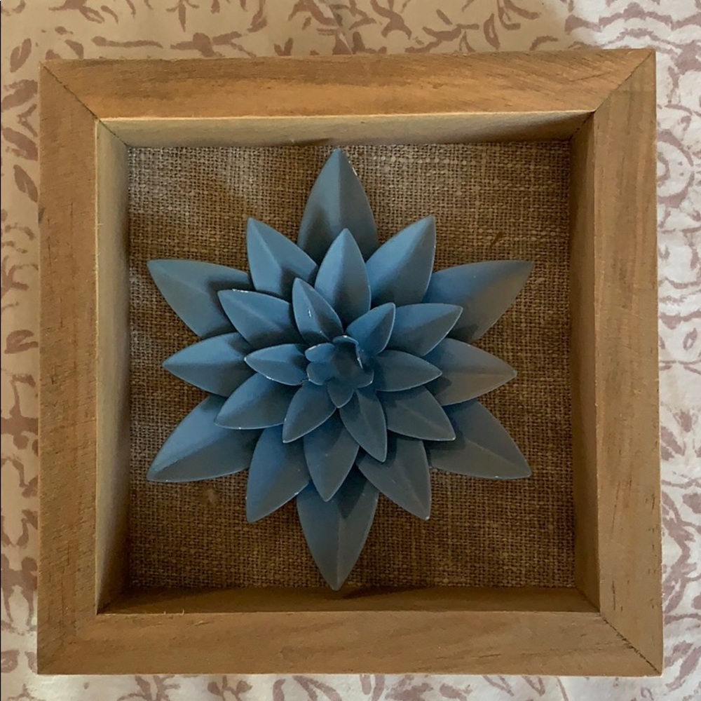 Blue flower accents behind burlap
